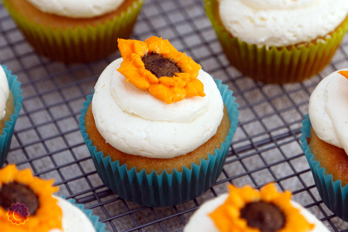 Eggless vanilla cupcakes topped with vanilla buttercream frosting